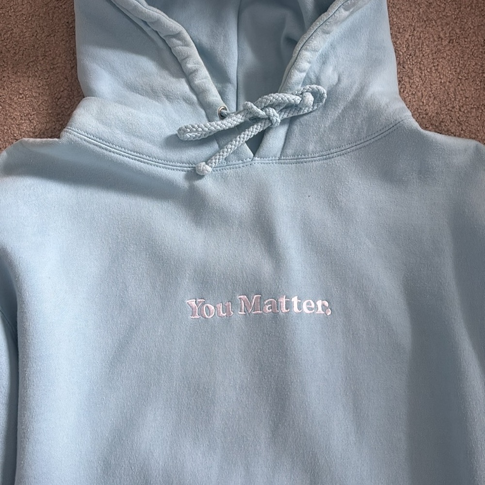 Light Blue You Matter Hoodie with Embroidered Logo (Demetrius Harmon)
